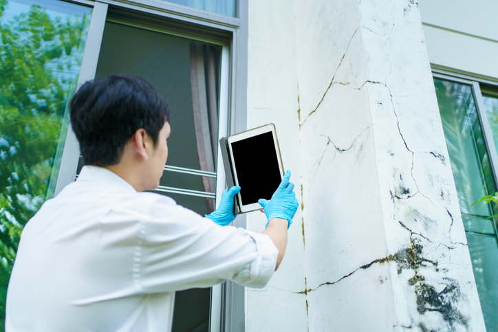 Claim agent examining a damaged property.